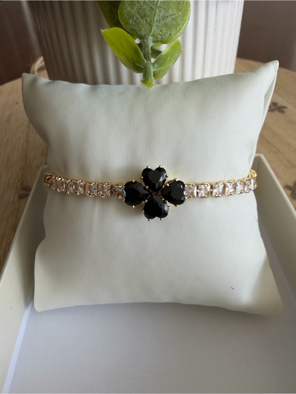 Gold Tone Bracelet with Black Clover Accent